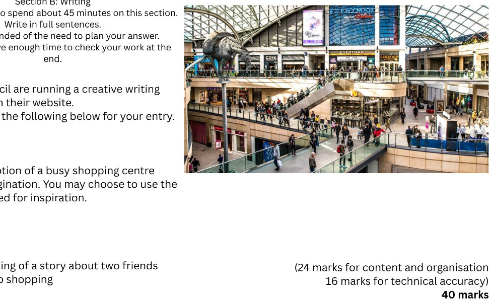 A cropped educational worksheet page showing a large shopping mall interior photograph with many people walking through a multi-level atrium. Partial text appears on the left and bottom right, suggesting this is part of a writing or creative writing assignment.